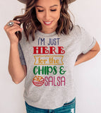 "I'm Just Here For The Chips" design on a heather gray unisex t-shirt