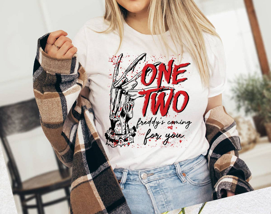 "One Two Freddy's Coming For You" design on a white unisex t-shirt