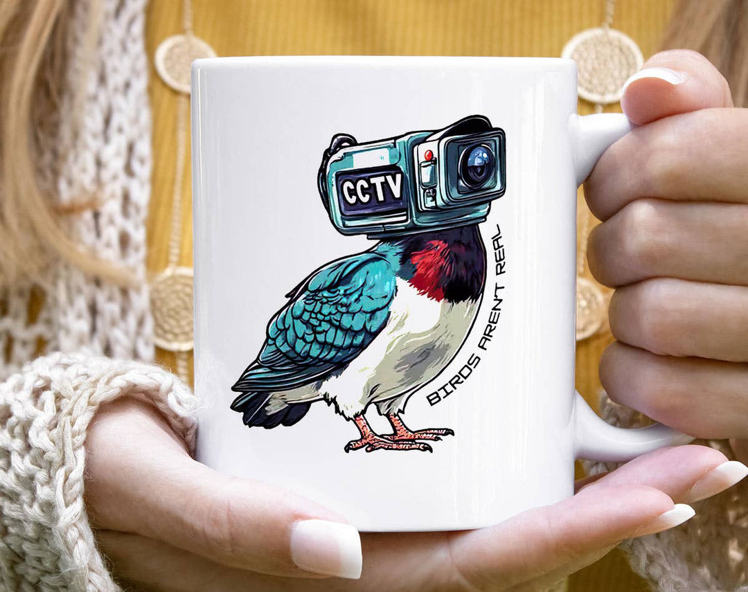 "Birds Aren't Real" design on a white ceramic coffee mug
