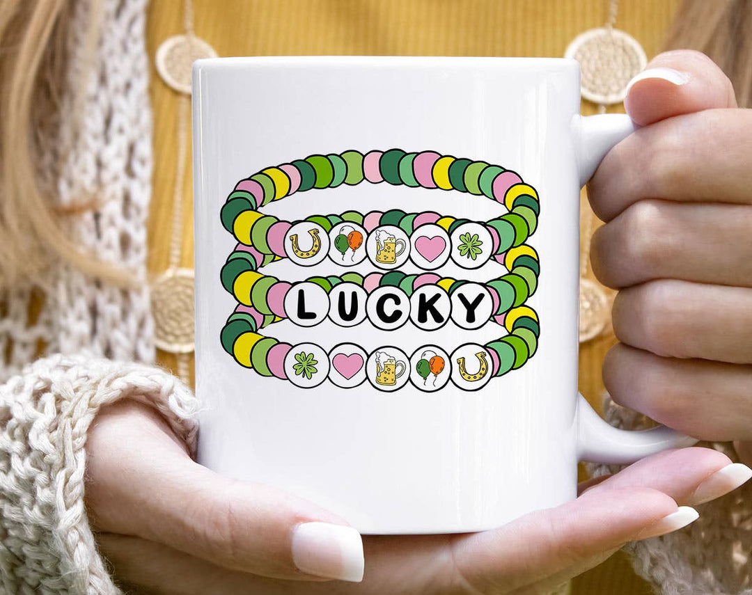 "Lucky Friendship Bracelet" design on a white ceramic coffee mug