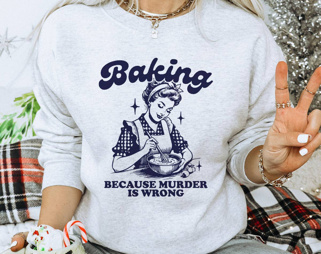 "Baking Because Murder Is Wrong" design on an ash gray unisex crewneck sweatshirt