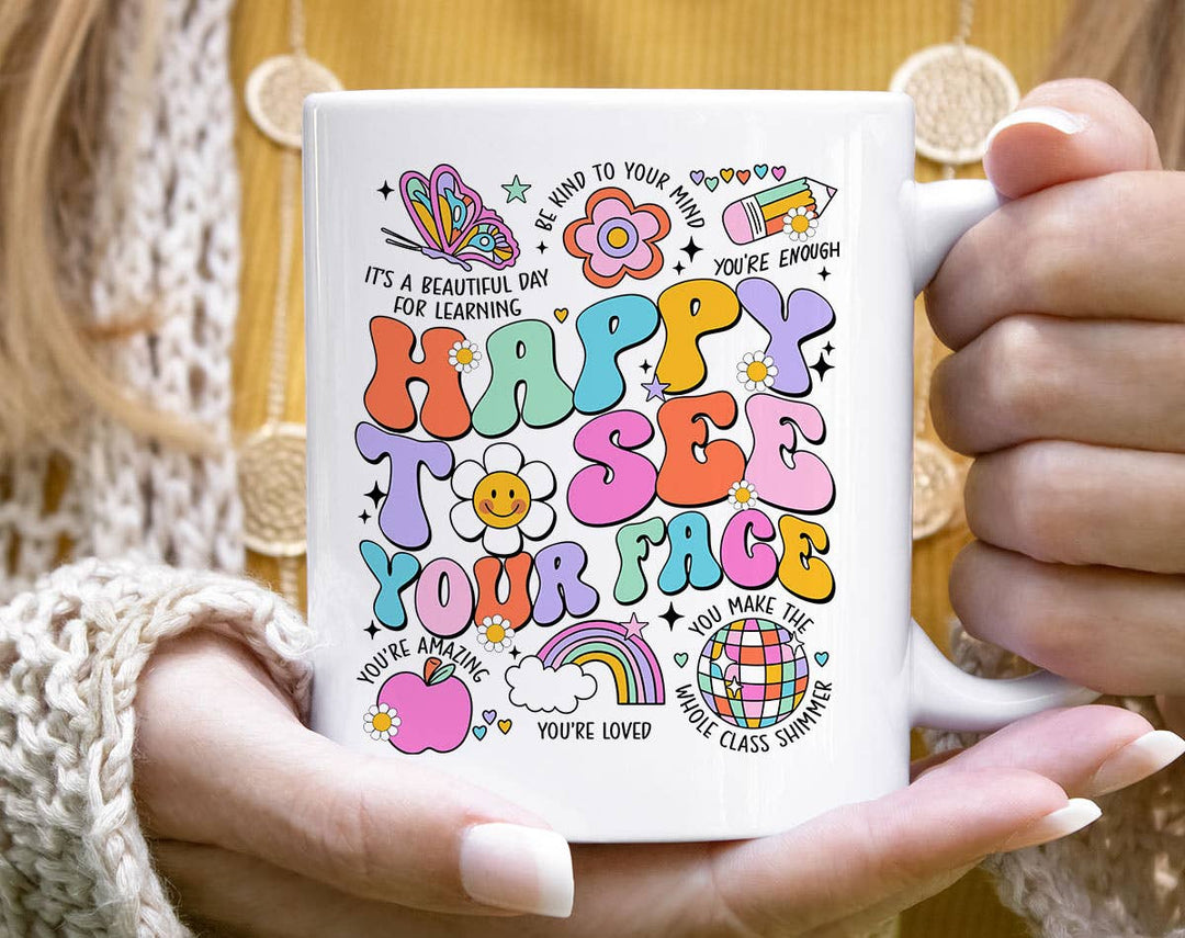 "Happy To See Your Face Teacher" design on a white ceramic coffee mug