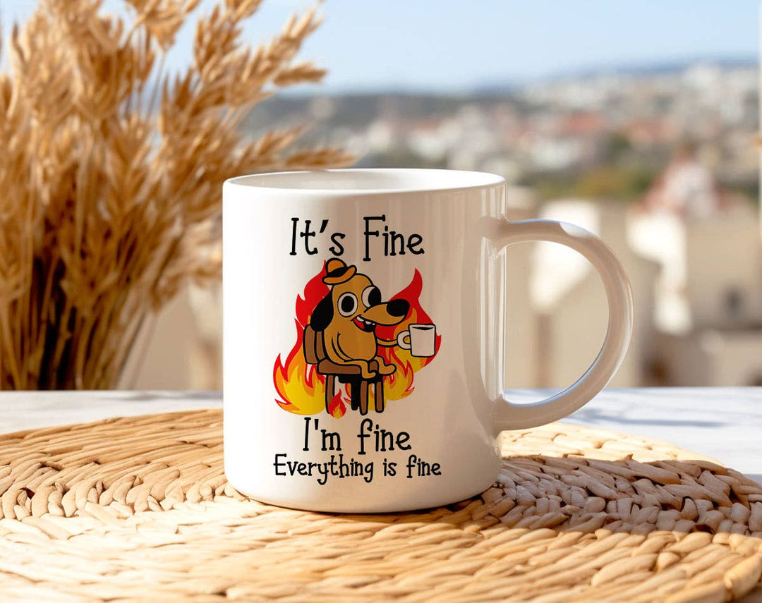 "It's fine I'm Fine Fire Dog" design on a white ceramic coffee mug