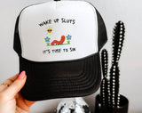 "Wake Up Sluts, It's Time To Sin" design on a mesh-back snapback trucker hat