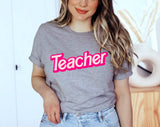 "Teacher Pink Logo" design on a heather gray unisex t-shirt