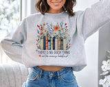 "There's No Such Thing As Too Many Books" design on an ash gray unisex crewneck sweatshirt