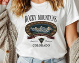 "Rocky Mountains Hiking" design on a white unisex t-shirt