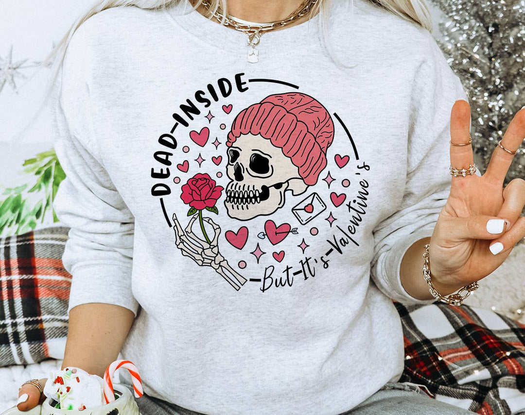 "Dead Inside But It's Valentine's Day" design on an ash gray unisex crewneck sweatshirt