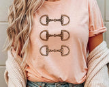"Brushstroke Horse Bit Cowgirl" design on a peach unisex t-shirt