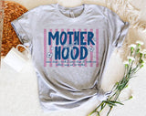 "Motherhood, Some Days I Rock It" design on a heather gray unisex t-shirt