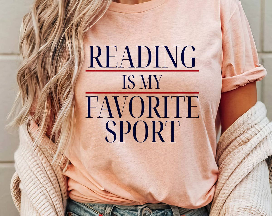 "Reading Is My Favorite Sport" design on a peach unisex t-shirt