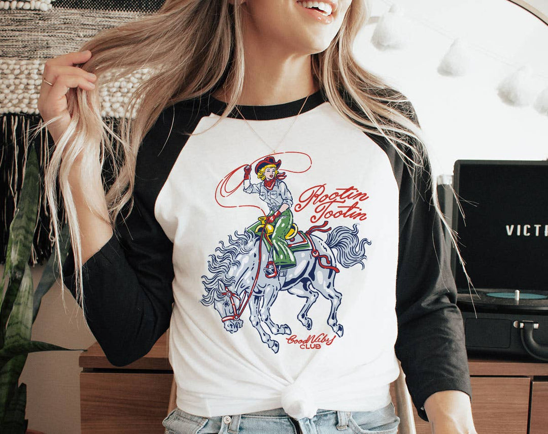 "Rootin' Tootin' Cowgirl" design on a white baseball raglan tee with black sleeves
