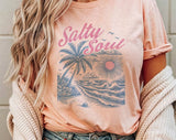 "Salty Soul Beach Palm Tree" design on a peach unisex t-shirt