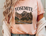 "Yosemite National Park" design on a peach unisex t-shirt