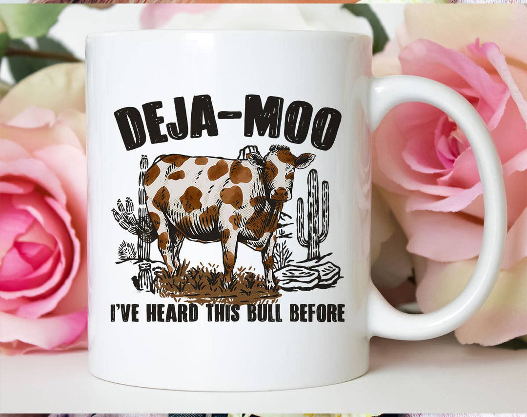 "Deja Moo, Heard This Bull Before" design on a white ceramic coffee mug