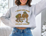 "Frog & Toad Ate Cookies" design on an ash gray unisex crewneck sweatshirt