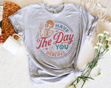 "Have The Day You Deserve" design on a heather gray unisex t-shirt