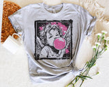 "Cupid Bubblegum Stamp" design on a heather gray unisex t-shirt