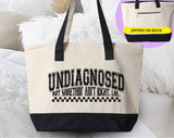 "Undiagnosed, But Something Ain't Right" design on a natural canvas zippered tote bag