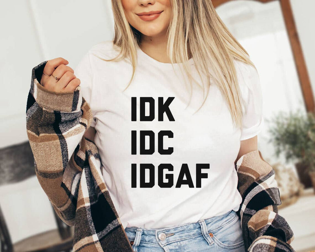 "IDGAF" design on a peach unisex t-shirt