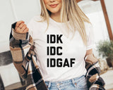 "IDGAF" design on a peach unisex t-shirt