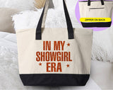 "In My Showgirl Era" design on a natural canvas zippered tote bag