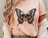 "Skull Butterfly Gothic Moth" design on a peach unisex t-shirt
