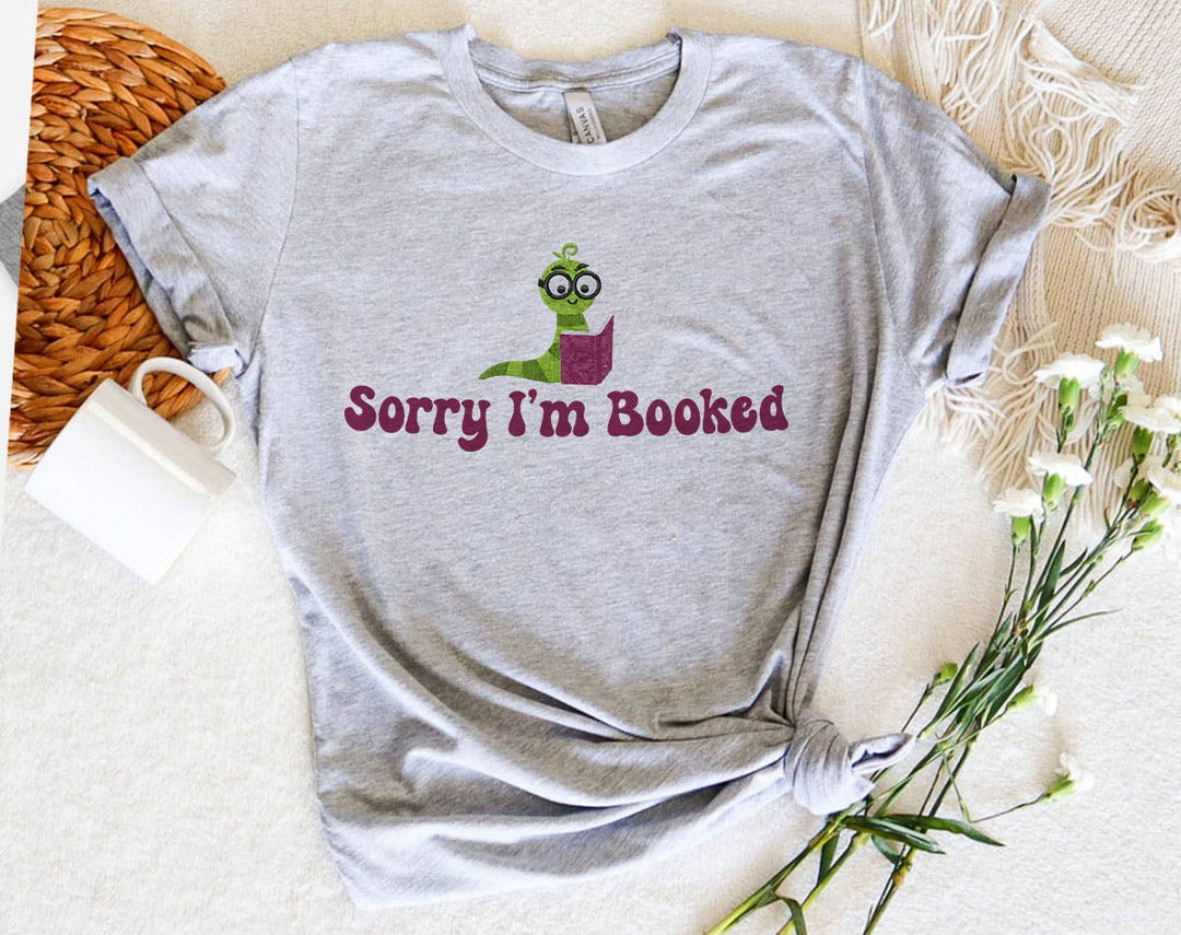 "Sorry I'm Booked" design on a heather gray unisex t-shirt