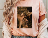 "Cat Getting Tattoo Meme" design on a peach unisex t-shirt