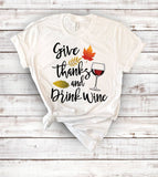 "Give Thanks And Drink Wine" design on a white unisex t-shirt