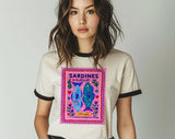"Sardines Purple Stamp" design on a natural ringer t-shirt with black contrast trim
