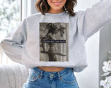 "Girls Will Be Girls Medusa Women's Rights" design on an ash gray unisex crewneck sweatshirt