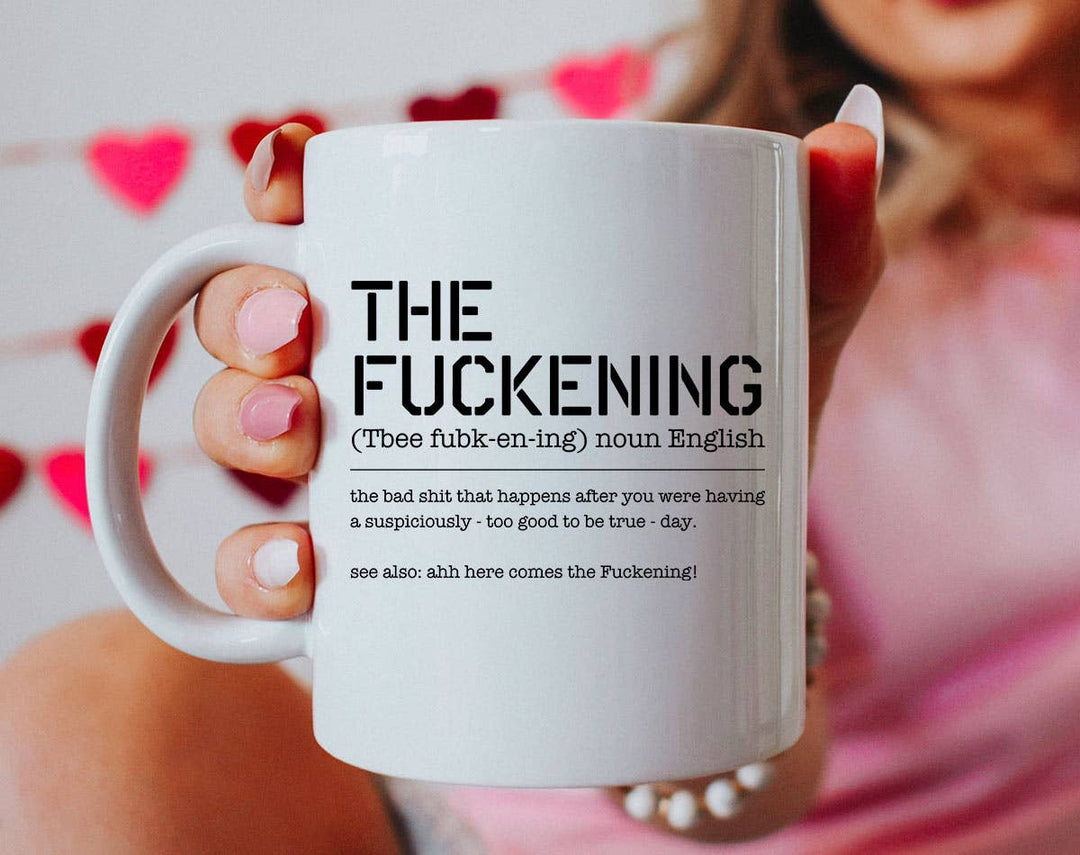 "The Fuckening Definition" design on a white ceramic coffee mug