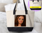 "Disgusted Doll Face Meme" design on a natural canvas zippered tote bag