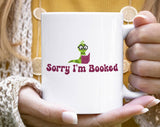 "Sorry I'm Booked" design on a white ceramic coffee mug