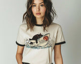 "Cat Riding Shark" design on a natural ringer t-shirt with black contrast trim