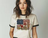 "American Flag Floral Painting" design on a natural ringer t-shirt with black contrast trim