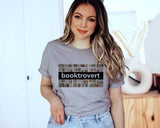 "Booktrovert Book Spines" design on a heather gray unisex t-shirt