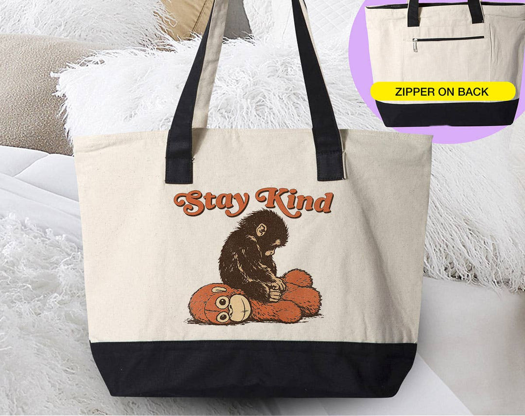 "Stay Kind Baby Punch Monkey" design on a natural canvas zippered tote bag