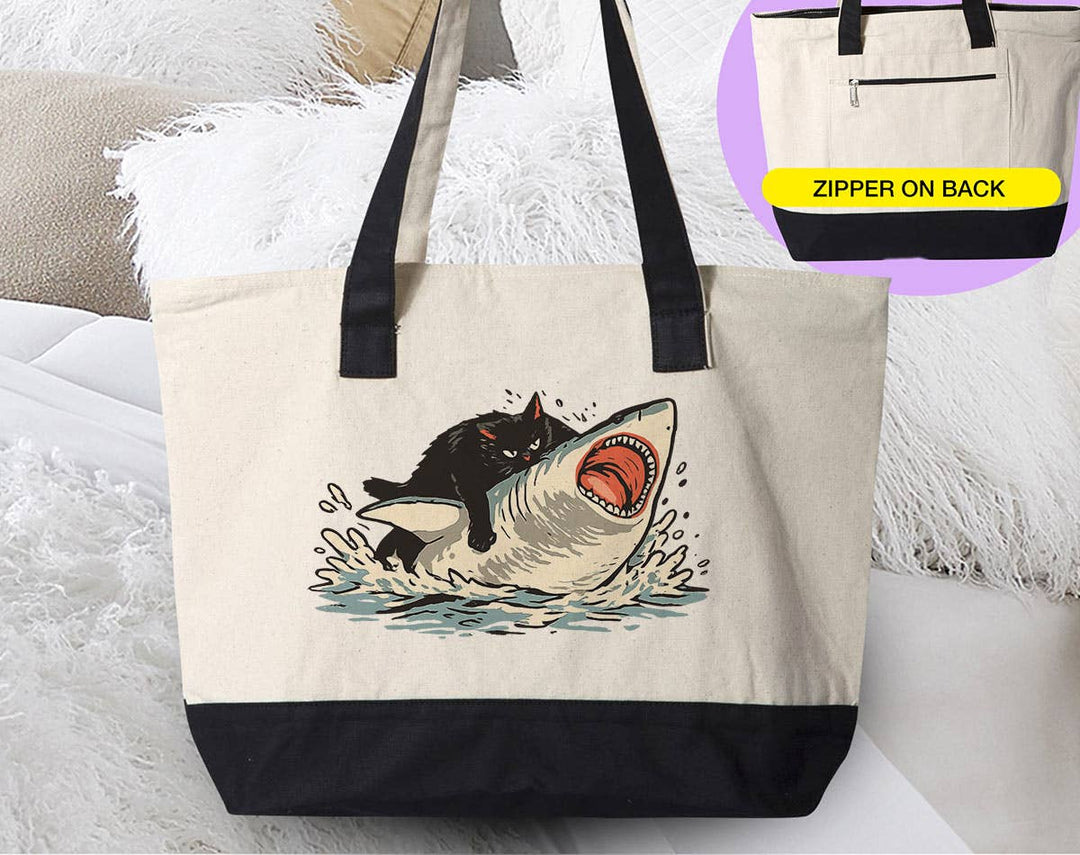 "Cat Riding Shark" design on a natural canvas zippered tote bag