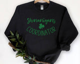 "Shenanigans Coordinator" design on a black unisex crewneck sweatshirt