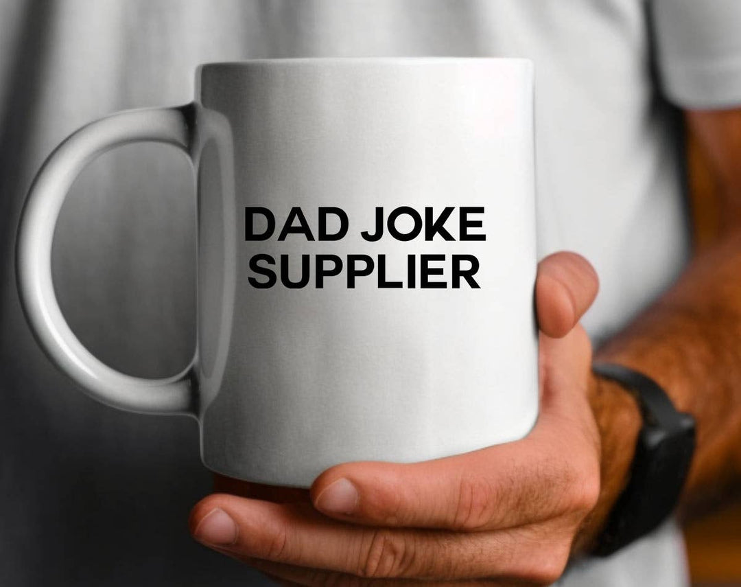 "Dad Joke Supplier" design on a white ceramic coffee mug