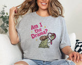 "Am I The Drama? Frog Meme" design on a heather gray unisex t-shirt