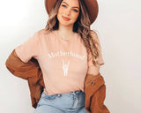 "Motherhood Rock N Roll" design on a peach unisex t-shirt