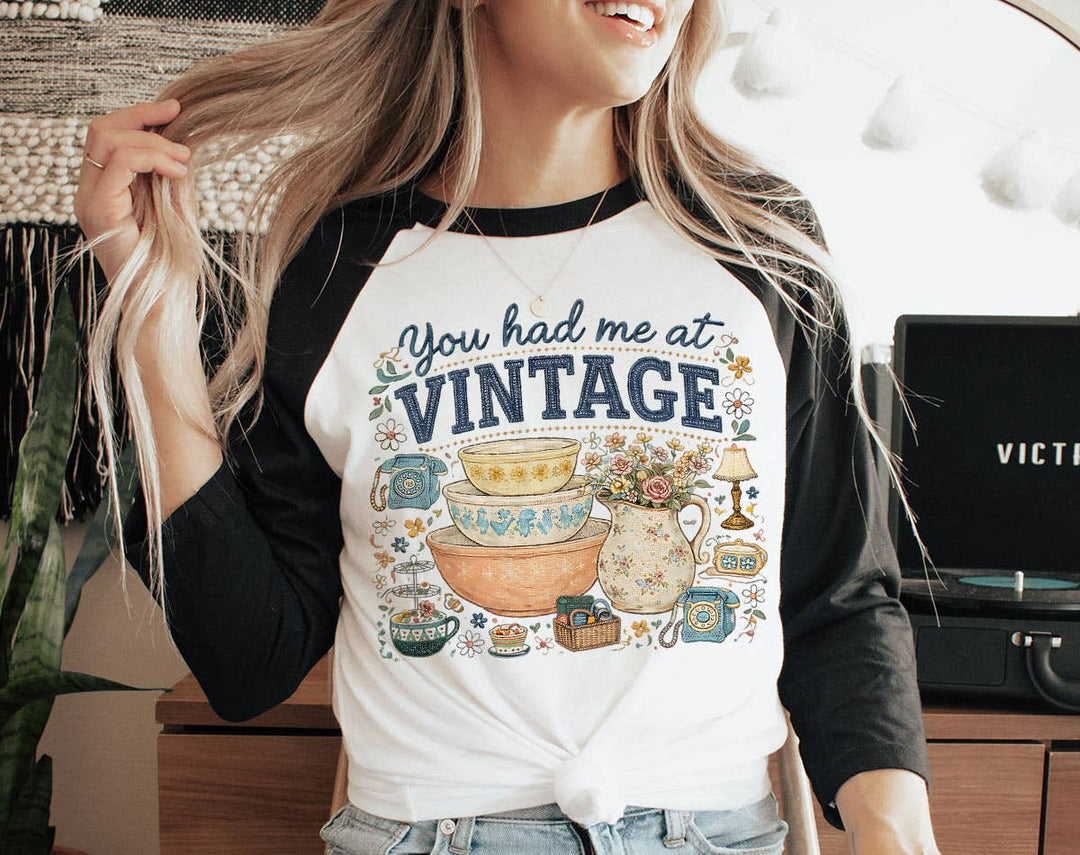"You Had Me At Vintage Thrifting" design on a white baseball raglan tee with black sleeves