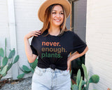 "Never Enough Plants" design on a black unisex t-shirt