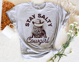 "Stay Salty Cowgirl" design on a heather gray unisex t-shirt