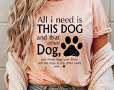 "All I Need Is This Dog And That Dog" design on a peach unisex t-shirt