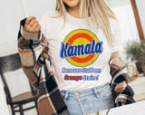 "Kamala Removes Orange Stains" design on a white unisex t-shirt