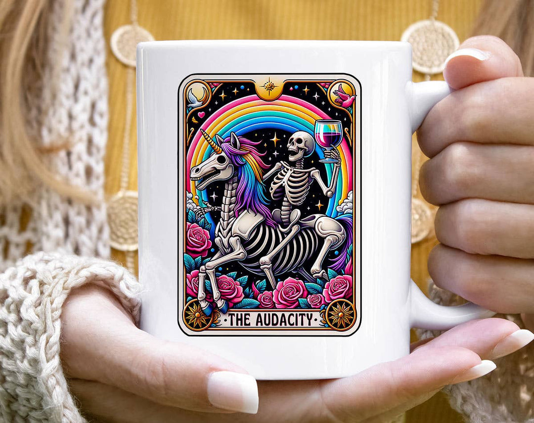 "The Audacity Unicorn Rainbow" design on a white ceramic coffee mug